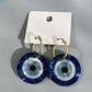 hoop evil eye earrings gold hoop glossy finish flat lay